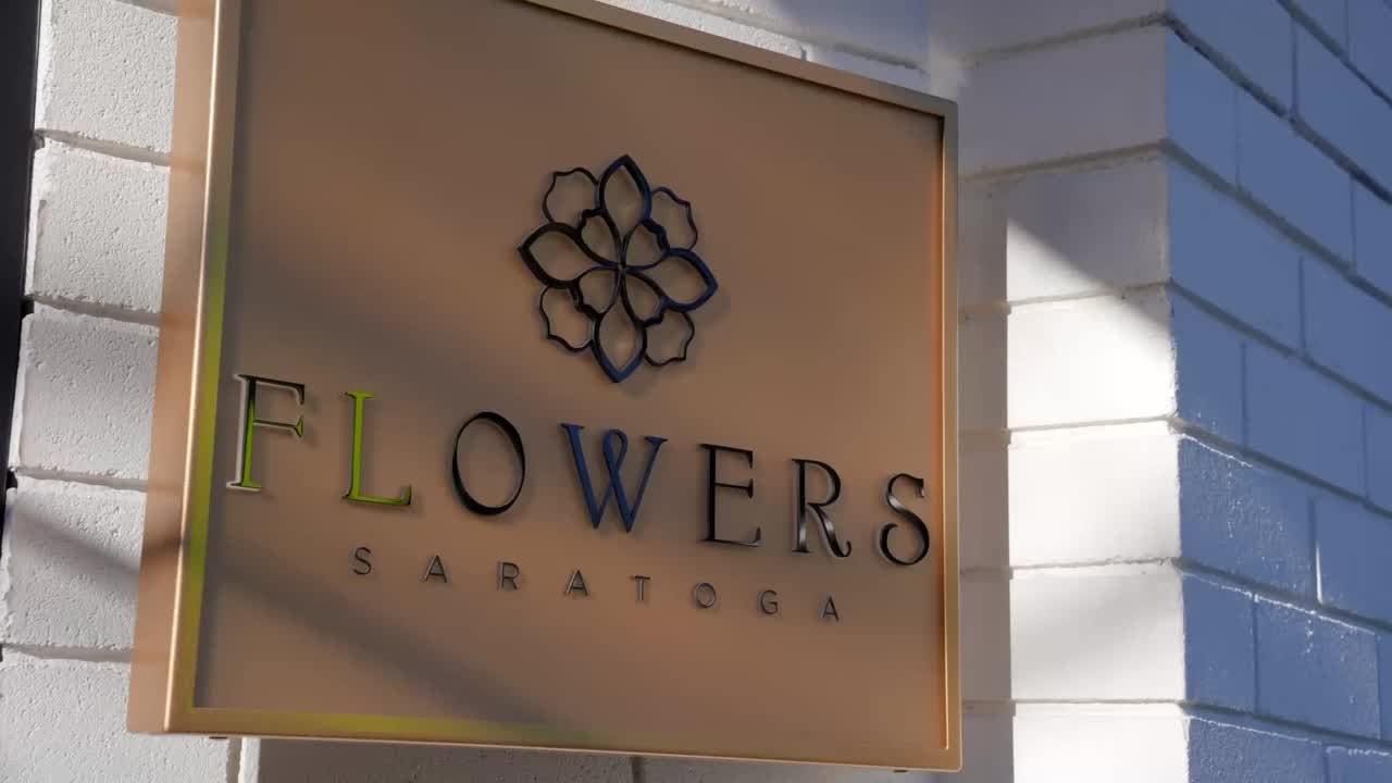 The Flowers Saratoga sign on Big Basin Way